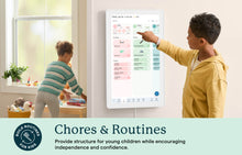 Load image into Gallery viewer, Children using the Skylight 27-inch digital family calendar to track chores and build morning routines on a wall-mounted smart screen.

