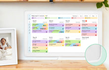 Load image into Gallery viewer, Color-coded weekly events organized on the Skylight 27-inch smart family calendar mounted on the wall.
